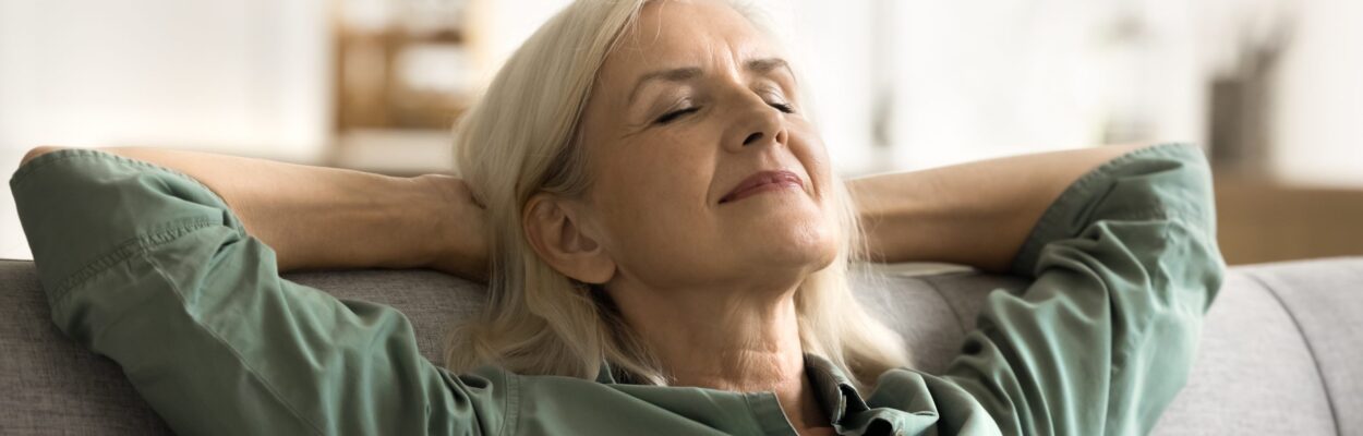 a woman with her eyes closed and her eyes closed