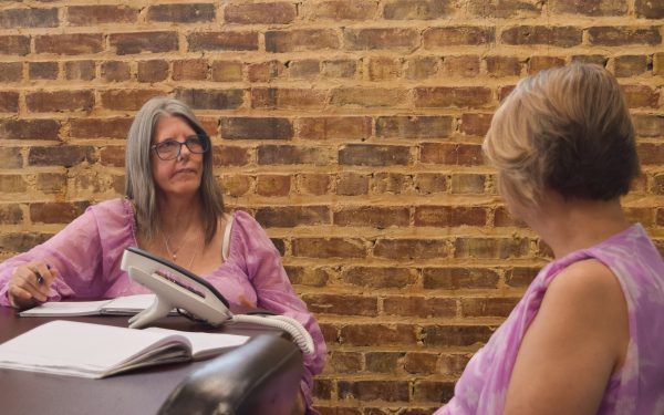 two women sitting at a table