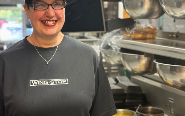 Person in kitchen with food preparation