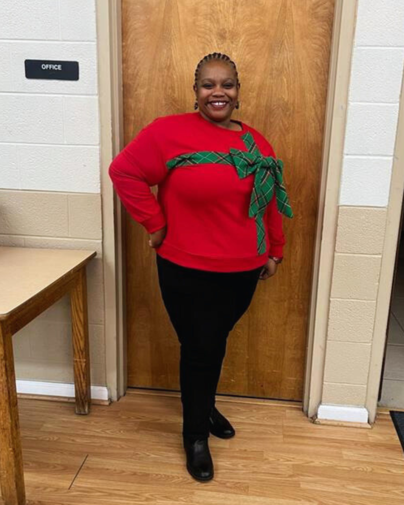 Person in festive red sweater.