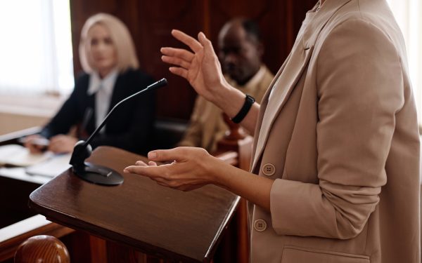 Person speaking at a courtroom podium