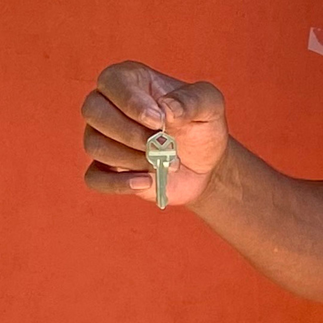 Person supported Billy Locklear holds the key to his apartment.
