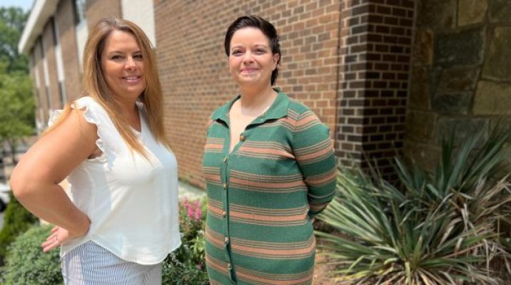 Monarch Tailored Care Management Manager Amy Eisenman, left, stands outside of Monarch offices in Wake County with person supported Shina Theimer.